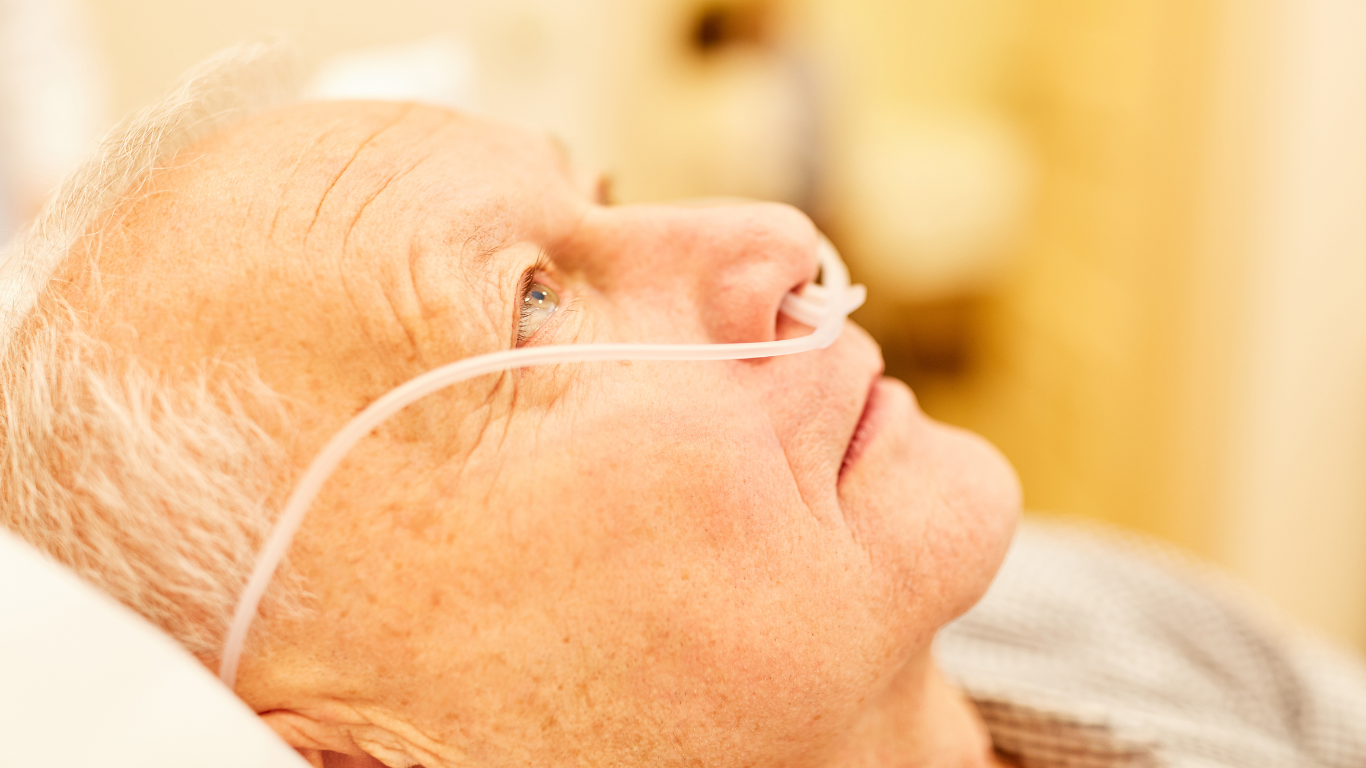 Sick senior with oxygen tube